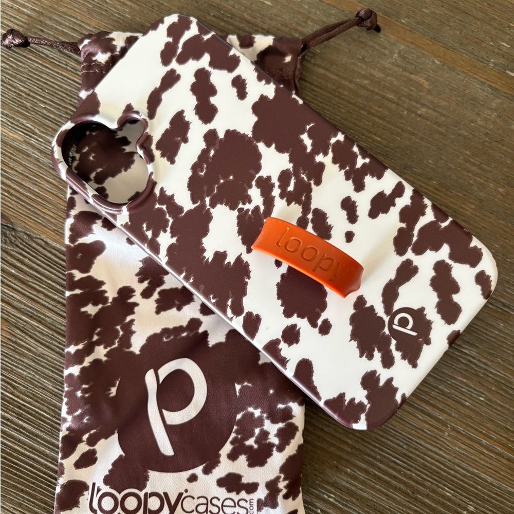 Loopy Case Brown and White Cow Print Phone Case with Orange Loopy Grip